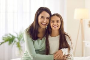 Smiling mother and daughter general dentistry patients at Plano, TX dentist