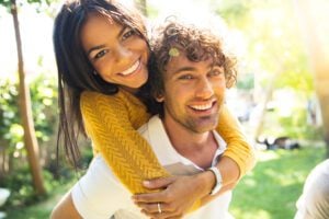A young couple smiling with confidence from tooth colored fillings.